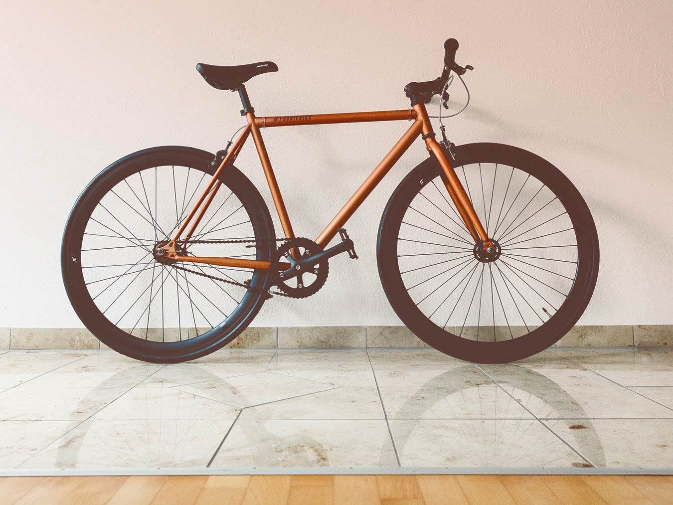 Bicycle Standing against Wall